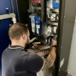 Connecting the cables in the main cabinet.